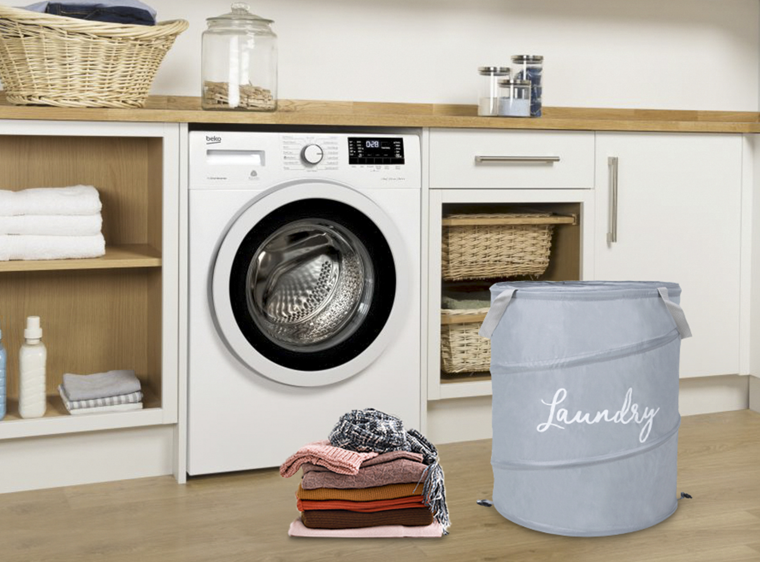 Grey Chenry pop-up laundry hamper in a bright laundry room